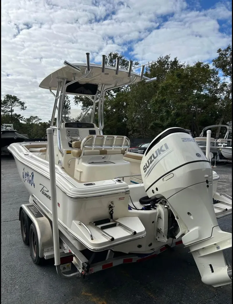 Slide: The Image of 2020 Pioneer 222 Sportfish boat with Suzuki outboard motor on a trailer. - 5