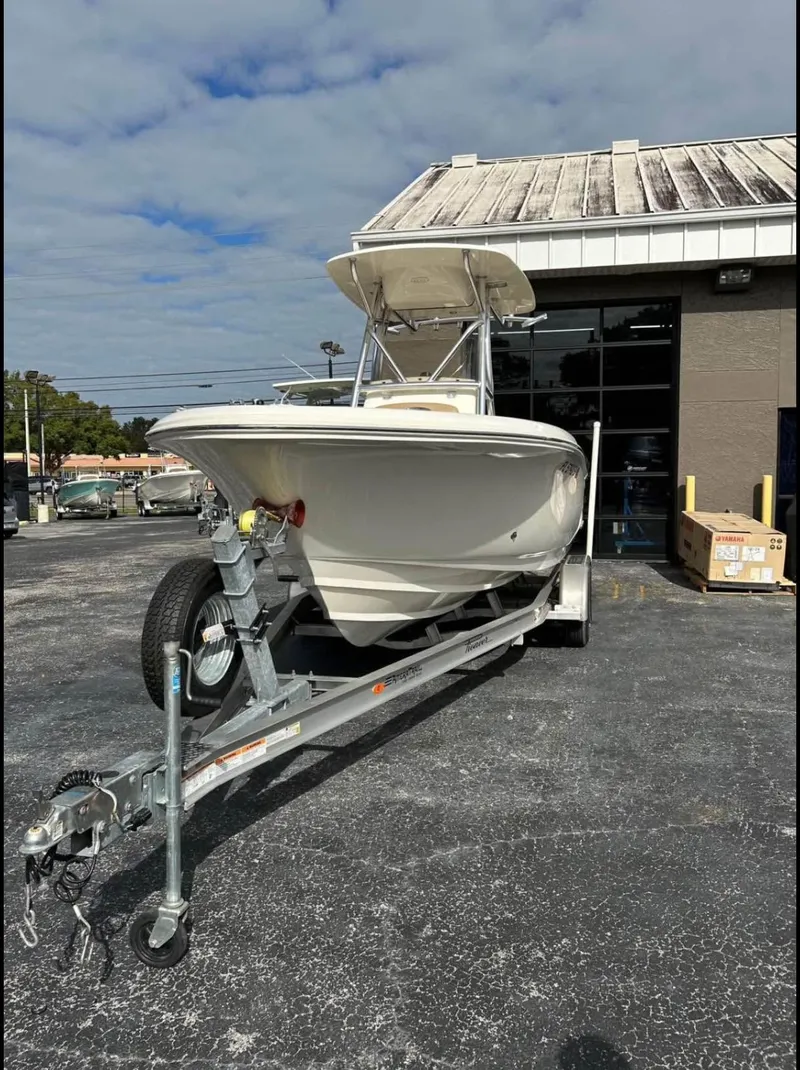 Slide: The Image of 2020 Pioneer 222 Sportfish boat on trailer outside a building. - 6