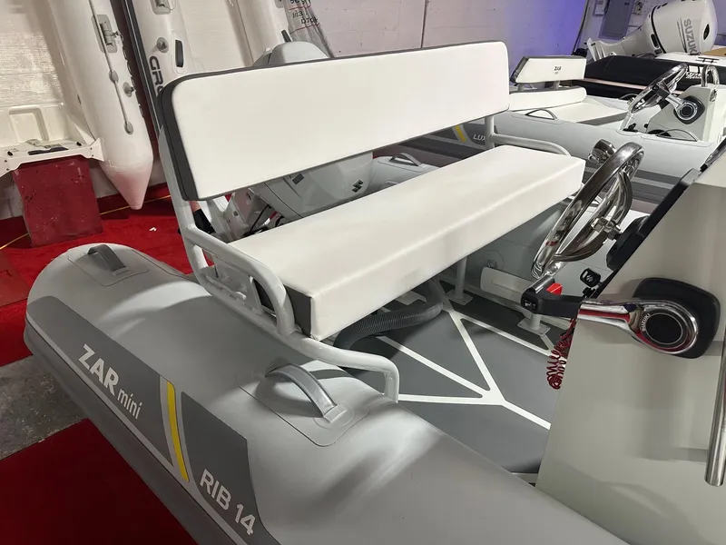 Slide: The Image of 2024 Zar Formenti ZAR Mini RIB 14 inflatable boat with white seating and steering console. - 6