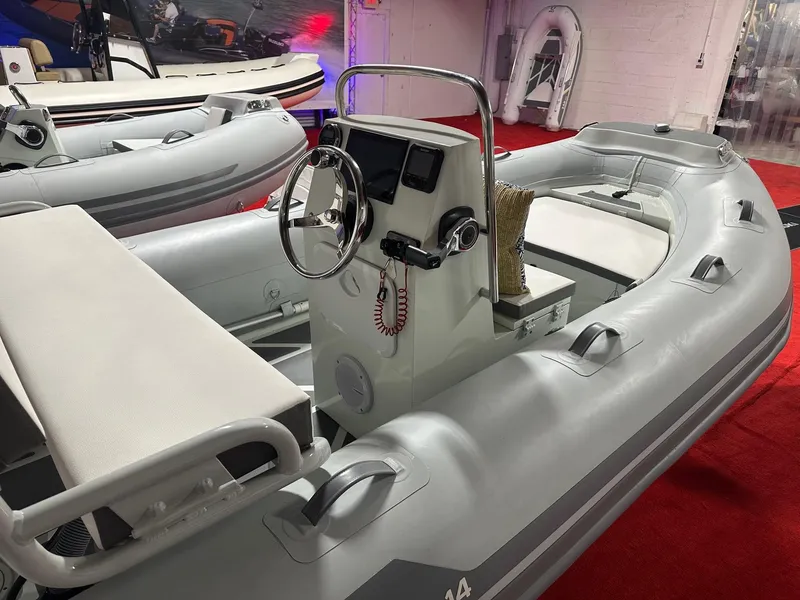 Slide: The Image of 2024 Zar Formenti ZAR Mini RIB 14 inflatable boat with steering console on display. - 7