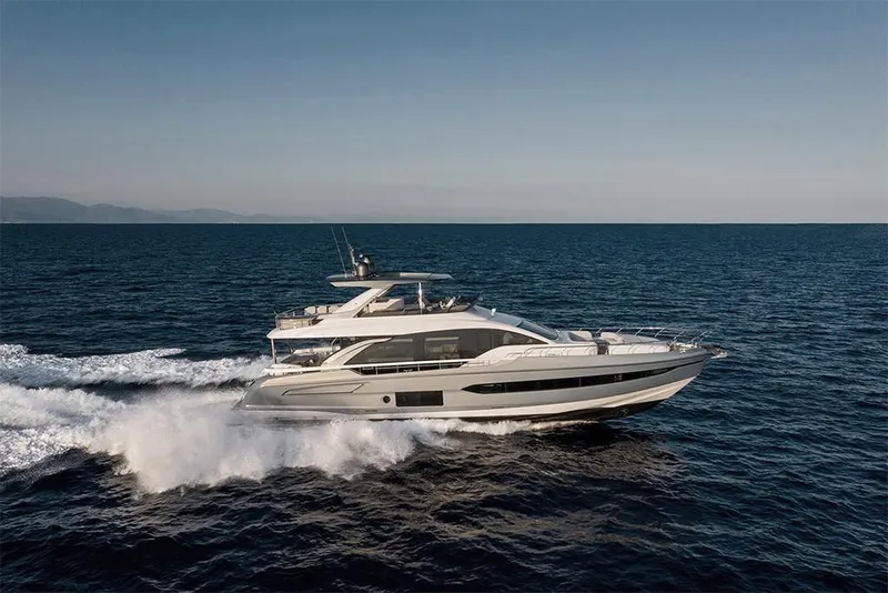 Slide: The Image of 2023 Azimut 78 yacht cruising on open water. - 2
