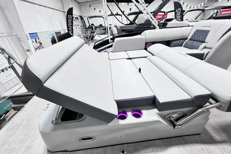 Slide: The Image of 2022 Harris FloteBote SOLTHICE 250 boat interior with adjustable seating and cup holders. - 29