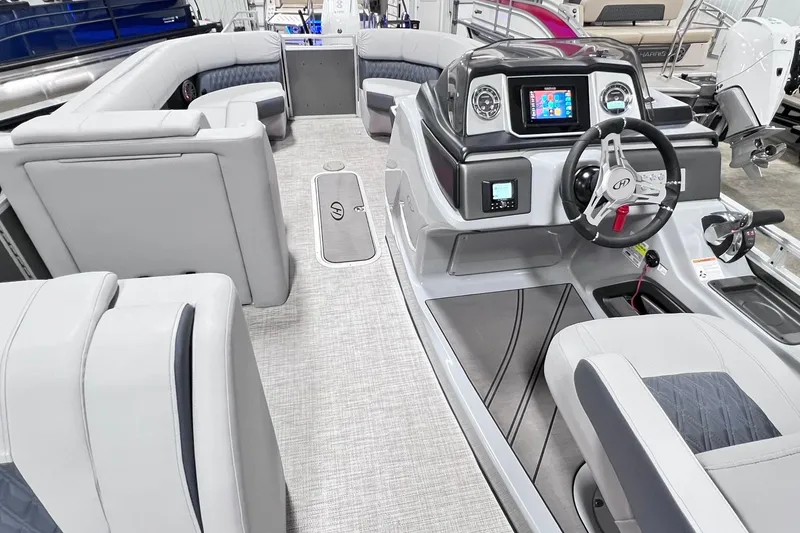 Slide: The Image of 2022 Harris FloteBote SOLTHICE 250 interior with modern helm and plush seating. - 31