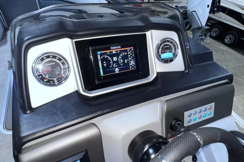 Slide: The Image of Dashboard of 2022 Harris FloteBote SOLTHICE 250 with Simrad display and gauges. - 34