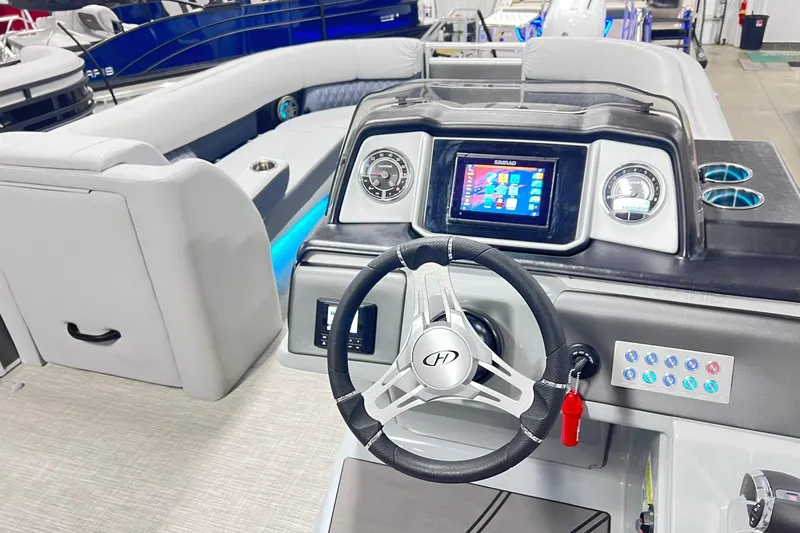 Slide: The Image of 2022 Harris FloteBote SOLTHICE 250 boat interior with modern dashboard and steering wheel. - 35
