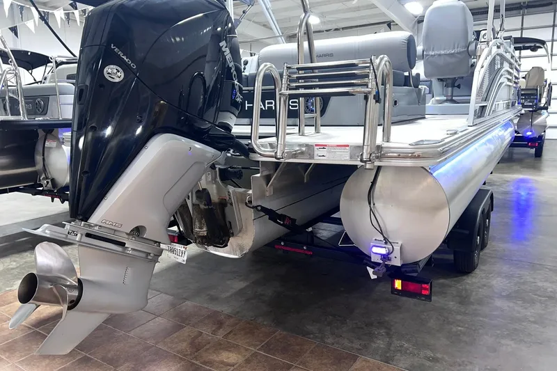 Slide: The Image of 2022 Harris FloteBote SOLTHICE 250 pontoon boat with Mercury outboard motor in showroom. - 52