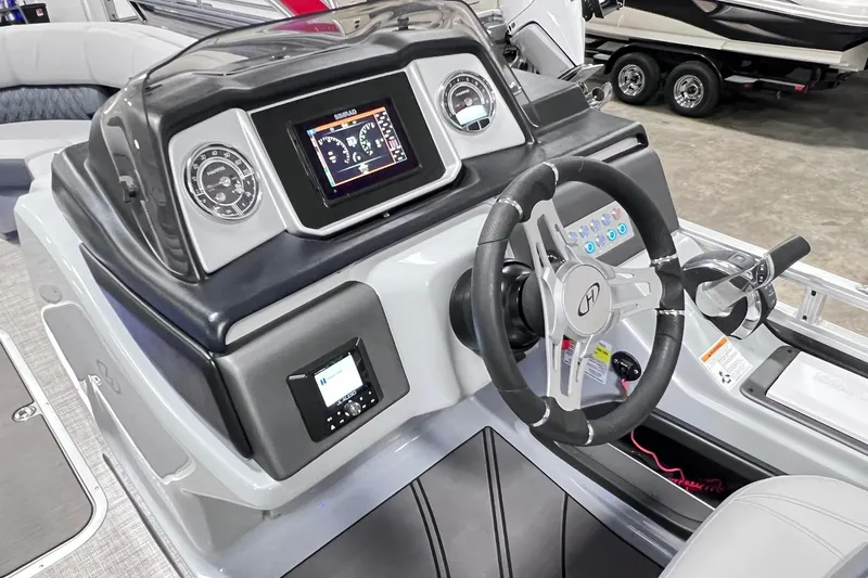Slide: The Image of Steering console of 2022 Harris FloteBote SOLTHICE 250 with modern controls and displays. - 8