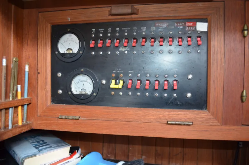 Slide: The Image of Electrical panel on a 1982 Young Sun Cutter sailboat with gauges and switches. - 16