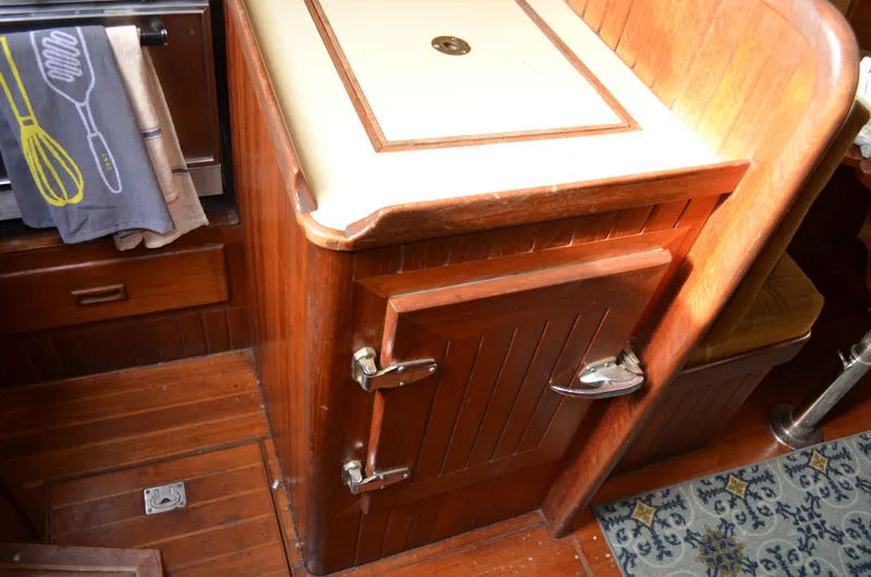 Slide: The Image of 1982 Young Sun Cutter interior with wooden cabinetry and countertop. - 20