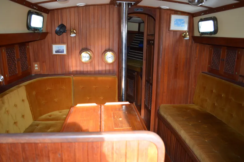 Slide: The Image of 1982 Young Sun Cutter interior with wood paneling and plush seating. - 23
