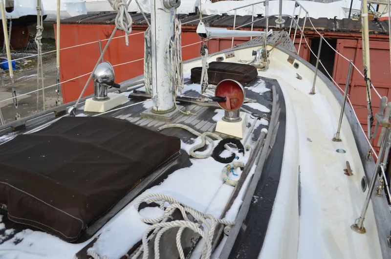 Slide: The Image of 1982 Young Sun Cutter sailboat deck with ropes and equipment. - 30