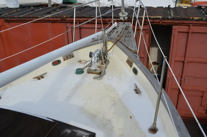 Slide: The Image of 1982 Young Sun Cutter sailboat deck with anchor and rigging. - 32