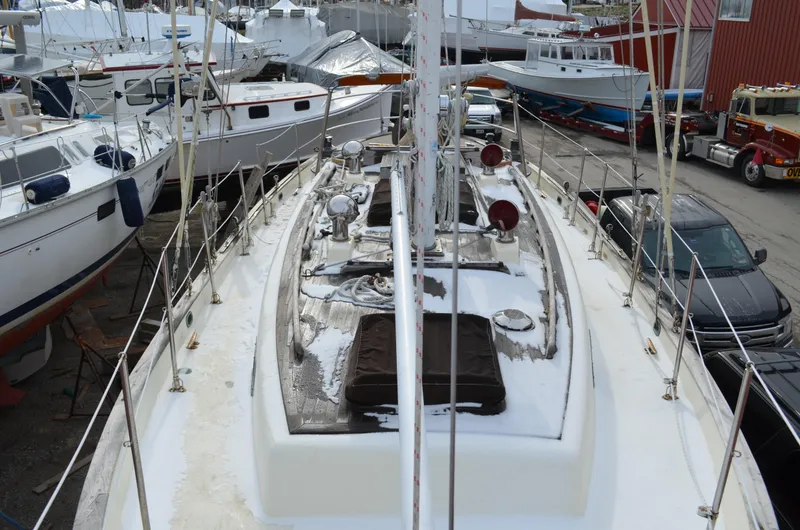 Slide: The Image of 1982 Young Sun Cutter sailboat docked among other vessels in a marina. - 35