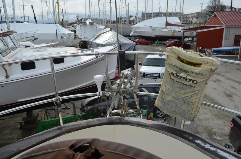 Slide: The Image of 1982 Young Sun Cutter in a boatyard with other vessels and equipment. - 41