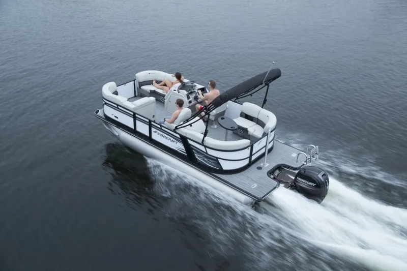 Slide: The Image of 2023 Starcraft SLS 5 pontoon boat cruising on water. - 13