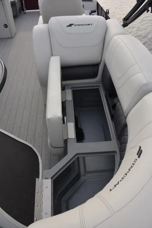Slide: The Image of 2023 Starcraft SLS 3 boat interior with storage compartment open. - 6