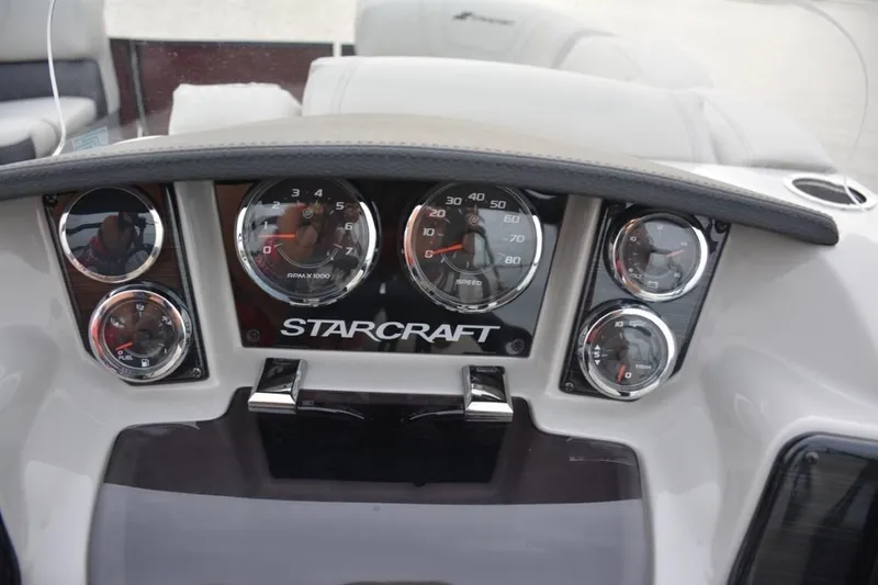 Slide: The Image of 2023 Starcraft SLS 3 boat dashboard with gauges and controls. - 8