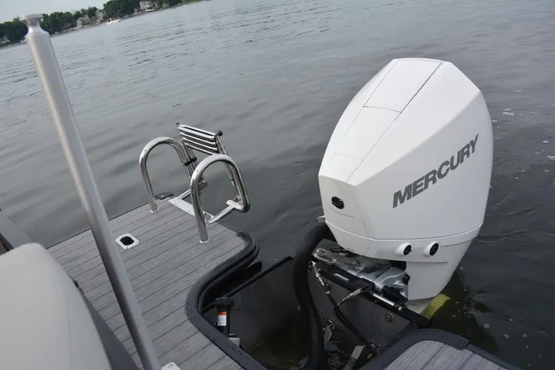Slide: The Image of 2023 Starcraft SLS 1 boat with Mercury outboard motor on a lake. - 22