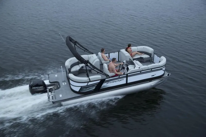 Slide: The Image of 2023 Starcraft SLS 1 pontoon boat cruising on water with passengers. - 7