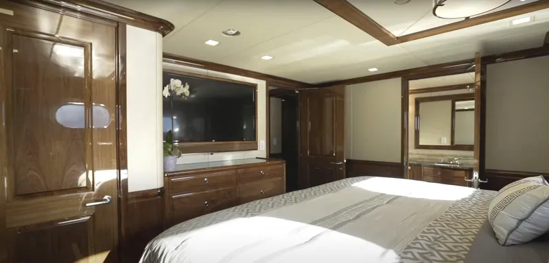 Slide: The Image of Luxurious bedroom interior of Christensen Model Year 2020 yacht with wooden furnishings. - 14