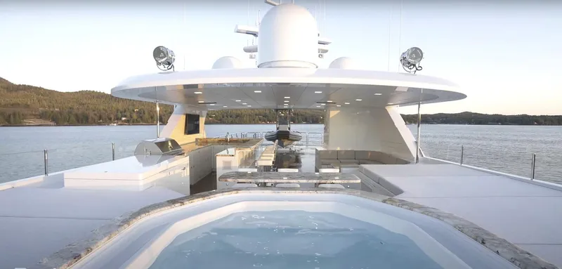 Slide: The Image of Luxury Christensen yacht Model Year 2020 with hot tub and outdoor dining area. - 18