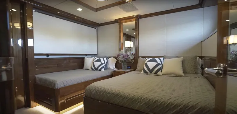 Slide: The Image of Luxurious bedroom interior of Christensen Model Year 2020 yacht with modern decor and comfortable bedding. - 21