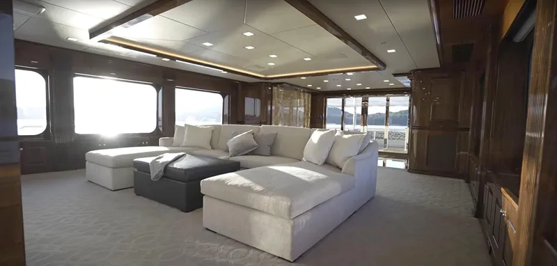 Slide: The Image of Luxurious interior of Christensen Model Year 2020 yacht with large windows and plush seating. - 3