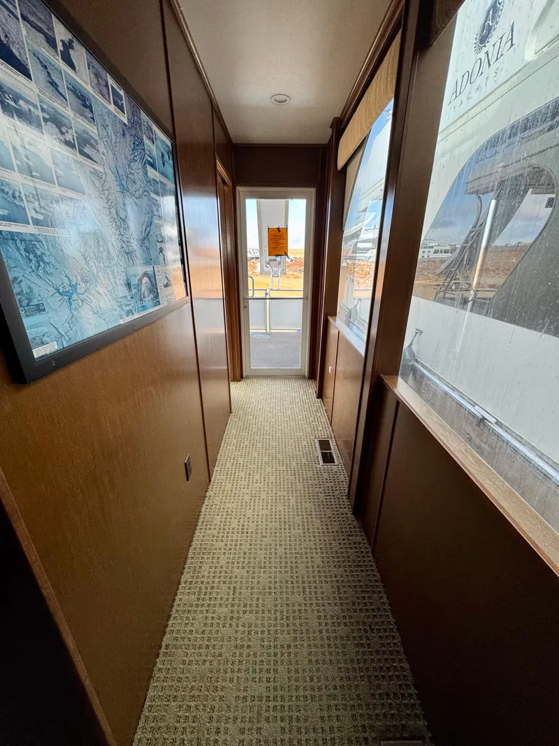 Slide: The Image of Hallway inside 2011 Bravada Dreamweaver Trip #16 houseboat with carpet and large windows. - 14