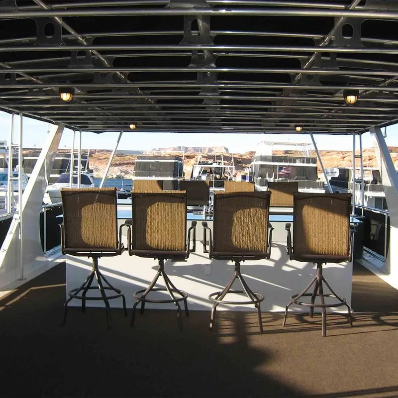 Slide: The Image of Four chairs on the deck of a 2011 Bravada Dreamweaver Trip #16 houseboat. - 25