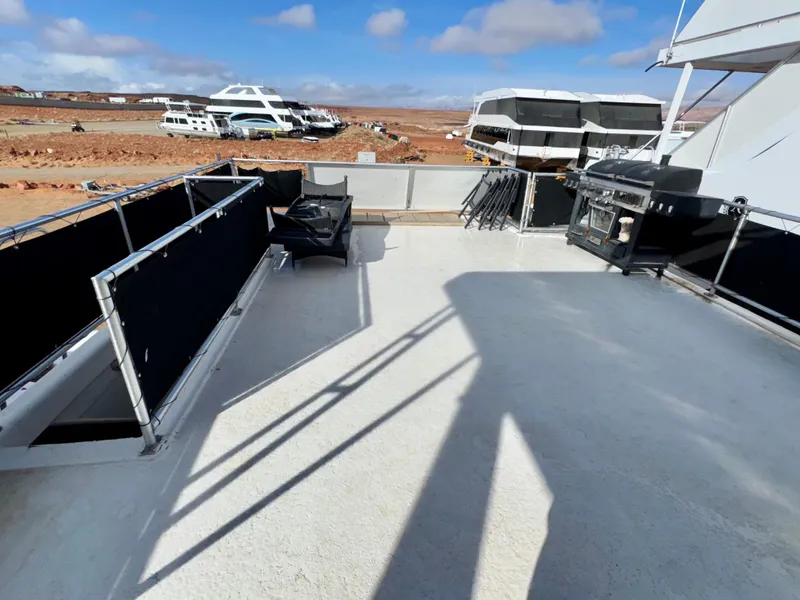 Slide: The Image of Upper deck of 2011 Bravada Dreamweaver Trip #16 houseboat, docked with other boats nearby. - 30