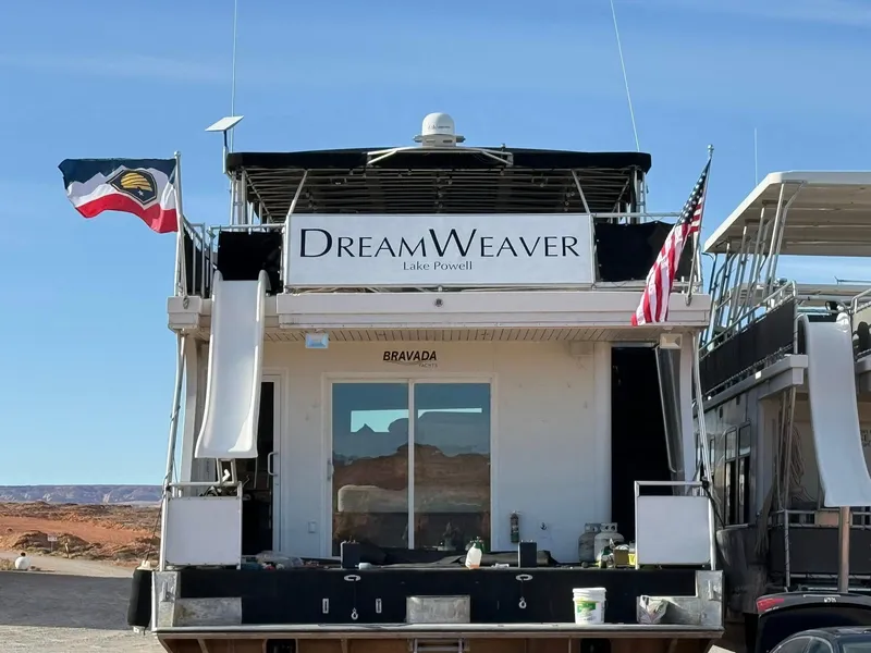 Slide: The Image of Houseboat "Dreamweaver" by Bravada, Lake Powell, 2011 model, with flags and scenic backdrop. - 37
