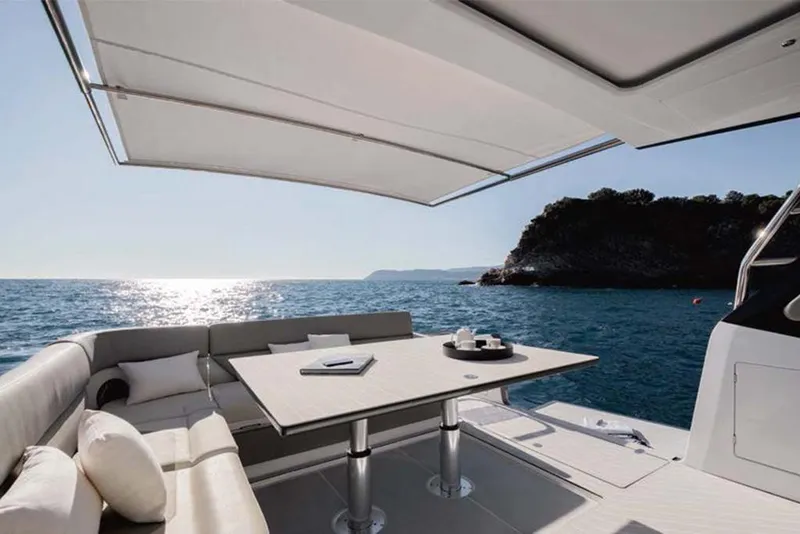 Slide: The Image of Luxury seating area on the 2023 Azimut Verve 47 yacht with ocean view. - 15