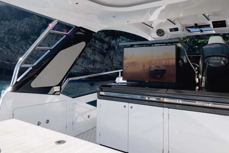 Slide: The Image of Luxury interior of 2023 Azimut Verve 47 yacht with TV and sleek design. - 16