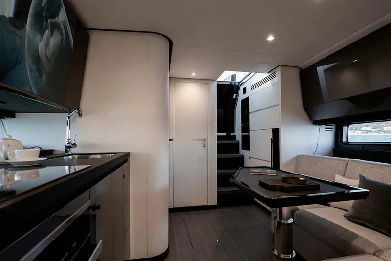 Slide: The Image of Interior of 2023 Azimut Verve 47 yacht with modern kitchen and cozy seating area. - 20