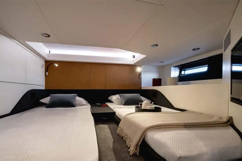 Slide: The Image of Luxurious cabin interior of 2023 Azimut Verve 47 yacht with twin beds. - 21