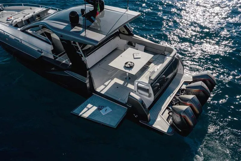 Slide: The Image of 2023 Azimut Verve 47 luxury yacht on open water, rear deck view. - 4