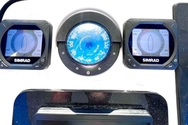Slide: The Image of Boat dashboard with Simrad instruments and compass on a 2002 Intrepid 366. - 12