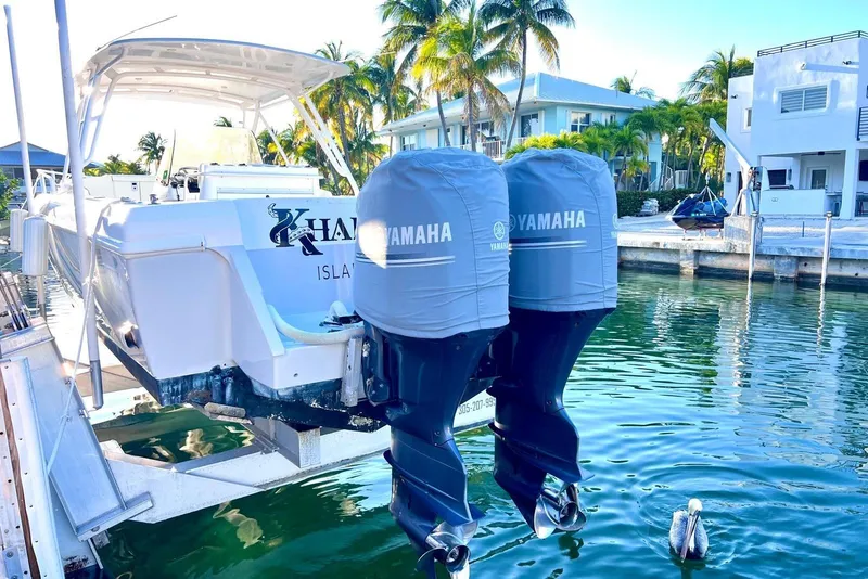 Slide: The Image of 2002 Intrepid 366 boat with Yamaha engines docked by waterfront homes. - 4