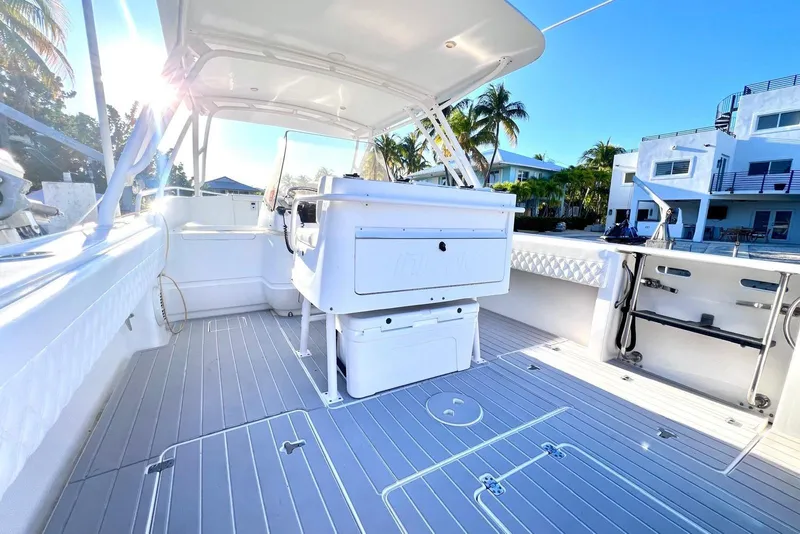 Slide: The Image of 2002 Intrepid 366 boat interior with sleek design, spacious deck, and modern amenities. - 5