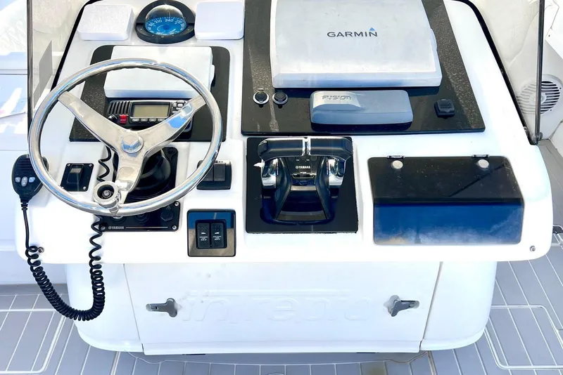 Slide: The Image of Control panel of a 2002 Intrepid 366 boat with Garmin navigation system. - 9