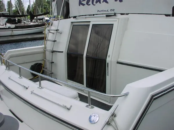 Slide: The Image of 1991 Carver 430 Cockpit Motor Yacht with sliding doors and ladder, docked in Portland, OR. - 15
