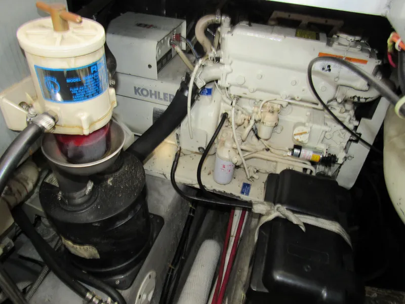 Slide: The Image of Engine room of 1991 Carver 430 Cockpit Motor Yacht with visible components. - 17