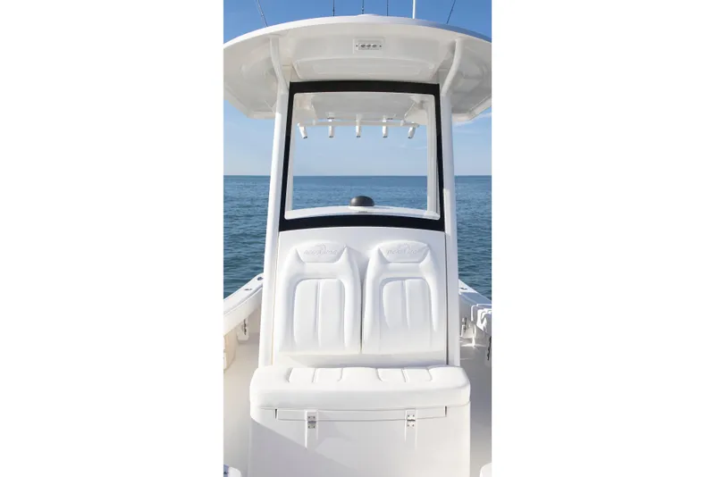 Slide: The Image of 2026 Regulator 24XO boat interior with white seating, ocean view in background. - 4