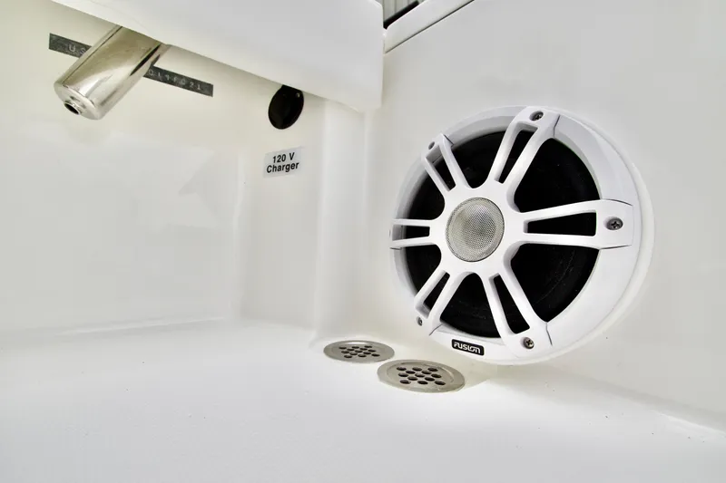 Slide: The Image of 2026 Regulator 24XO boat interior with speaker and 120V charger. - 5