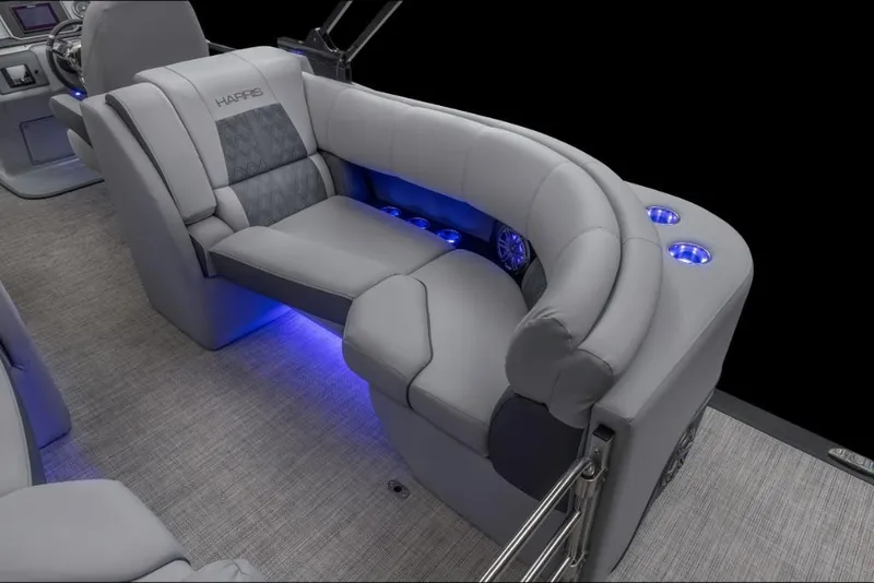 Slide: The Image of 2022 Harris Solstice 230 boat interior with gray seating and blue LED lighting. - 12