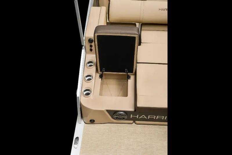 Slide: The Image of 2022 Harris Solstice 230 boat with open storage compartment and cup holders. - 18