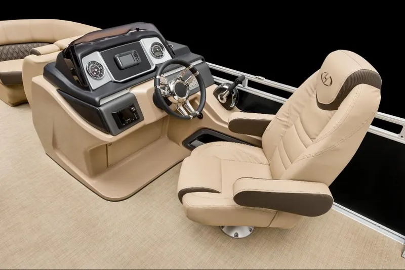 Slide: The Image of 2022 Harris Solstice 230 boat helm with beige captain's chair and modern dashboard. - 19