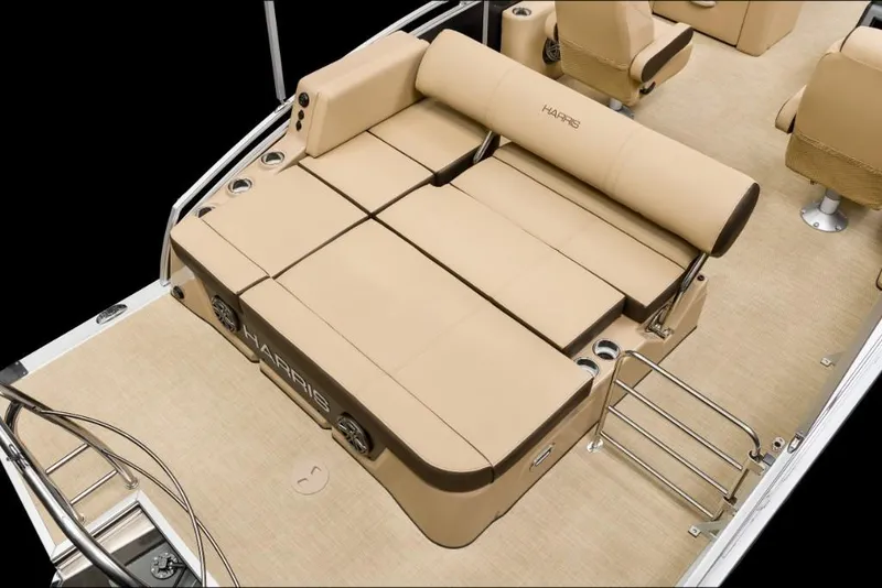 Slide: The Image of 2022 Harris Solstice 230 boat interior with beige seating and deck. - 21