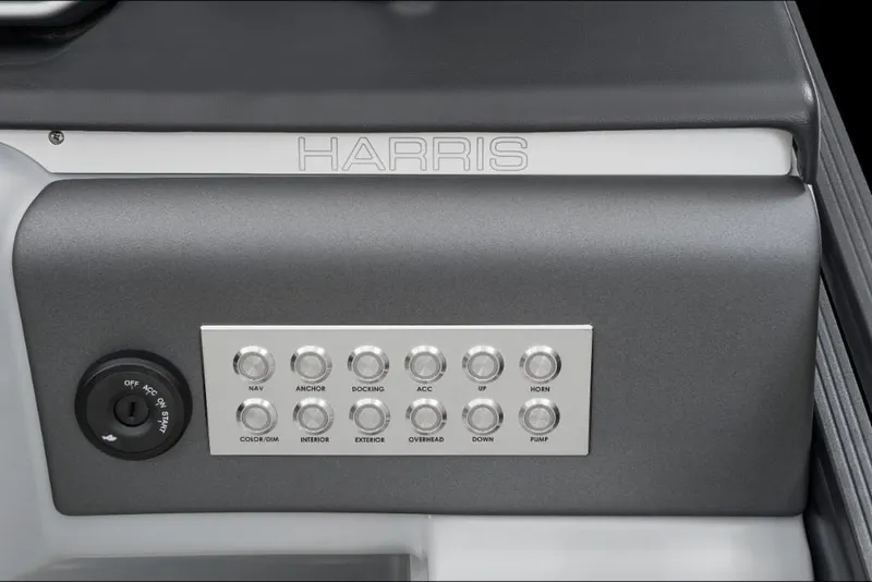 Slide: The Image of Control panel of 2022 Harris Solstice 230 boat with labeled buttons and ignition switch. - 26