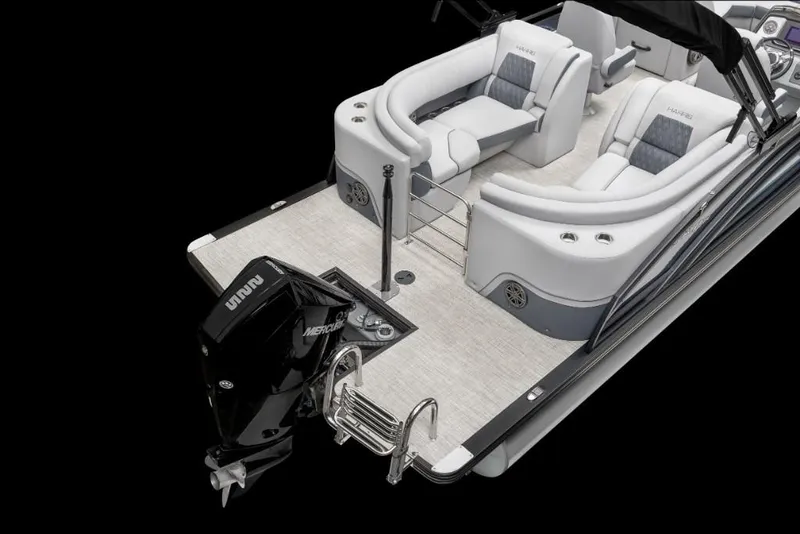 Slide: The Image of 2022 Harris Solstice 230 boat with Mercury outboard motor and luxurious seating. - 4